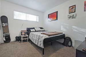 Bedroom with carpet flooring and baseboards