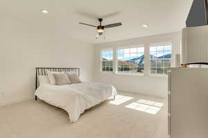 Bedroom with light carpet, recessed lighting, baseboards, and ceiling fan