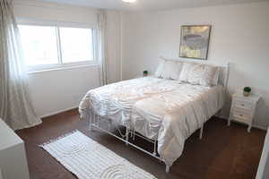 Carpeted bedroom with baseboards