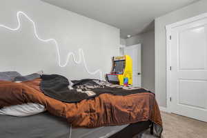 Bedroom with baseboards and carpet flooring