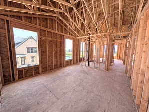 Primary bedroom with vaulted ceiling