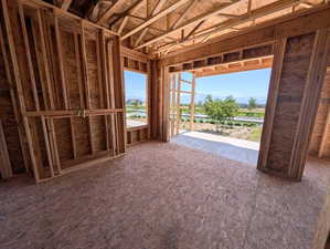 Great room with slider doors to covered porch and waterfront lot