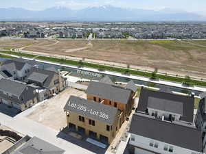 Aerial perspective of suburban area with a mountainous background