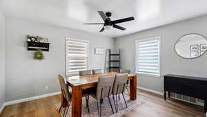 Dining area with ceiling fan, baseboards, and LVP floors