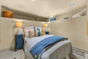 Bedroom featuring light colored carpet, recessed lighting, baseboards, and visible vents