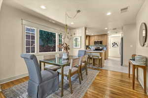 Dining area with visible vents, recessed lighting, baseboards, and light wood-style floors