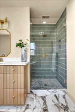 Full bath with visible vents, marble finish floor, a stall shower, and vanity