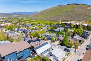 Aerial view of residential area featuring a mountain backdrop