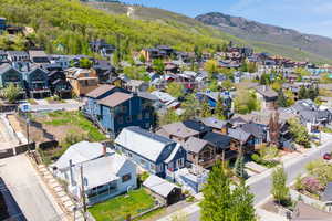 Aerial perspective of suburban area with a mountainous background