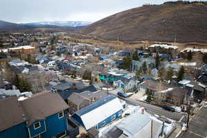 Drone / aerial view with a residential view and a mountain view