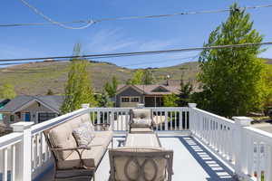 Balcony with an outdoor hangout area and a mountain view