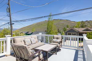 View of patio featuring outdoor lounge area and a mountain view