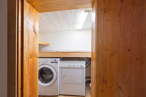 Laundry room featuring washer and clothes dryer