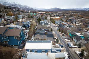 Drone / aerial view with a mountain view and a residential view