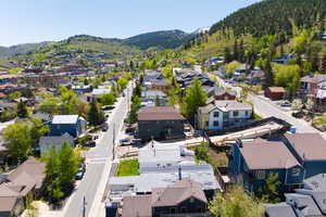 Aerial view of residential area featuring mountains