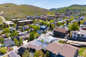 Aerial perspective of suburban area with a mountainous background