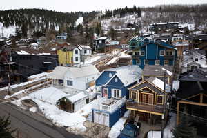 Snowy aerial view with a residential view