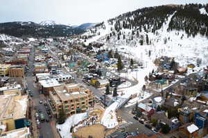 Snowy aerial view featuring a mountain view