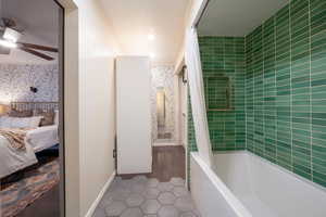 Ensuite bathroom with tub / shower combination, and walk-in closet