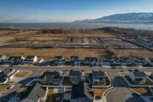 Drone / aerial view with a residential view and a water and mountain view