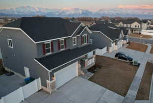 Birds eye view of property with a mountain view and a residential view