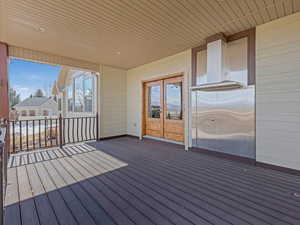 Wooden deck featuring french doors