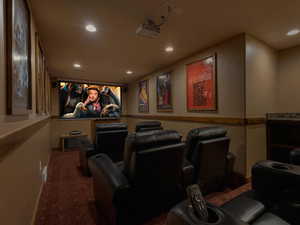 Carpeted home theater room featuring recessed lighting