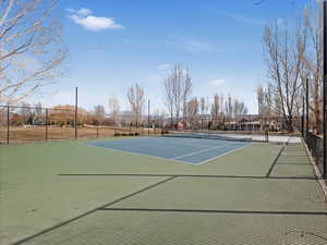 View of tennis court with fence