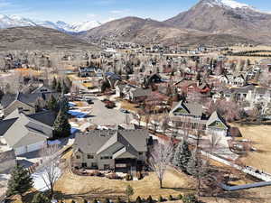 Birds eye view of property with a mountain view and a residential view