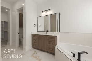 Bathroom featuring baseboards, toilet, a bath, marble finish floor, and vanity
