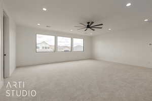 Unfurnished room featuring recessed lighting, light colored carpet, baseboards, and a ceiling fan