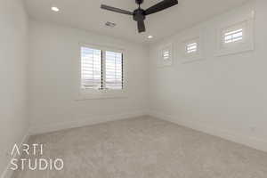 Carpeted spare room featuring recessed lighting, visible vents, baseboards, and a ceiling fan