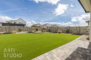 View of yard with a patio and a fenced backyard