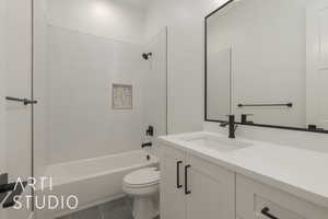 Full bathroom with vanity, tile patterned floors, toilet, and bathtub / shower combination