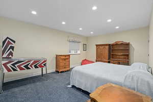 Carpeted bedroom featuring recessed lighting and baseboards