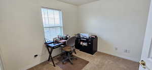 Carpeted office featuring baseboards