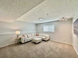 Basement family room or bedroom.  Natural light entering from window.