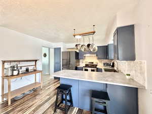Kitchen with ample space for bakers rack.