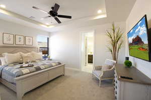 Bedroom with visible vents, baseboards, light colored carpet, recessed lighting, and a raised ceiling