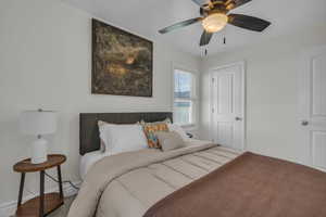 Bedroom with baseboards and a ceiling fan