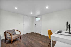 Office space featuring recessed lighting, baseboards, and dark wood-type flooring