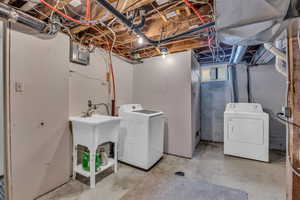 Laundry room with laundry area and washing machine and clothes dryer