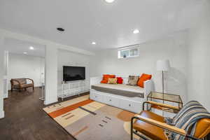 Living area with recessed lighting, baseboards, and wood finished floors