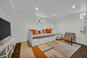 Bedroom featuring recessed lighting, wood finished floors, and baseboards