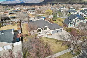 Birds eye view of property featuring a mountain view and a residential view