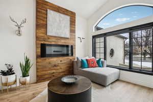 Living area featuring baseboards and wood finished floors