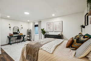 Bedroom featuring recessed lighting, baseboards, and wood finished floors