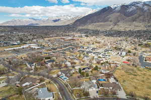 Birds eye view of property with a mountain view and a residential view