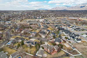 Birds eye view of property with a mountain view and a residential view