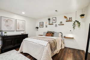 Bedroom with recessed lighting, visible vents, baseboards, and wood finished floors